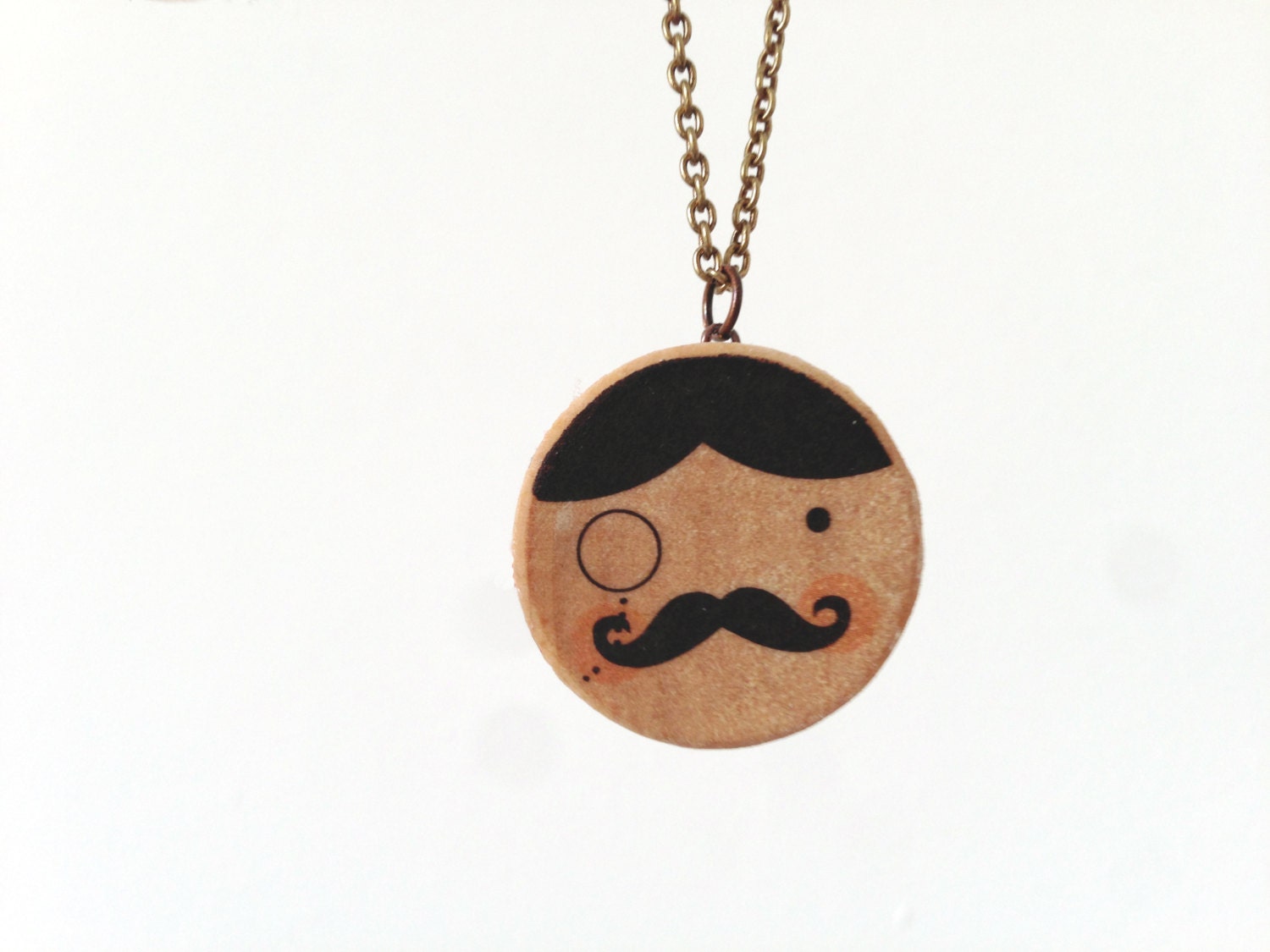 Pendant. Dandy printed in wooden circle