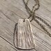 Fragment - An earthy porcelain pendant with details of mushrooms