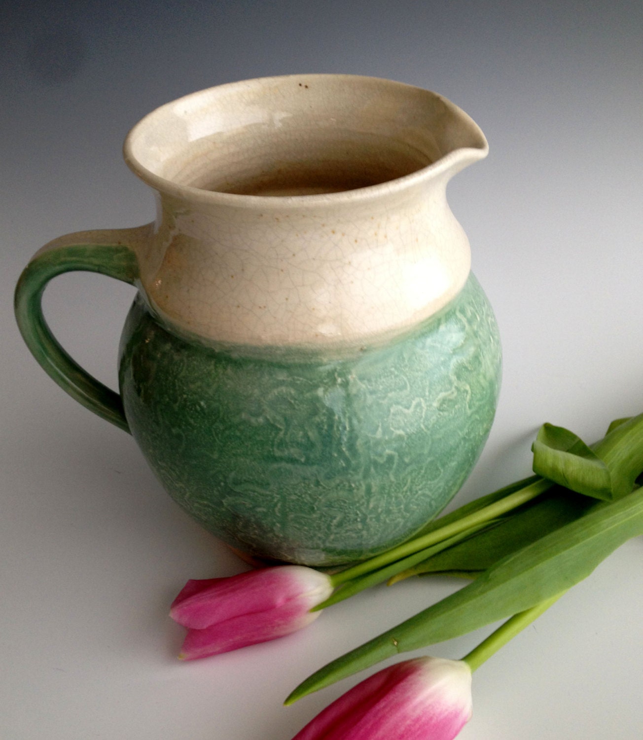 Handmade sage green textured pitcher. Stoneware pitcher by Leslie Freeman