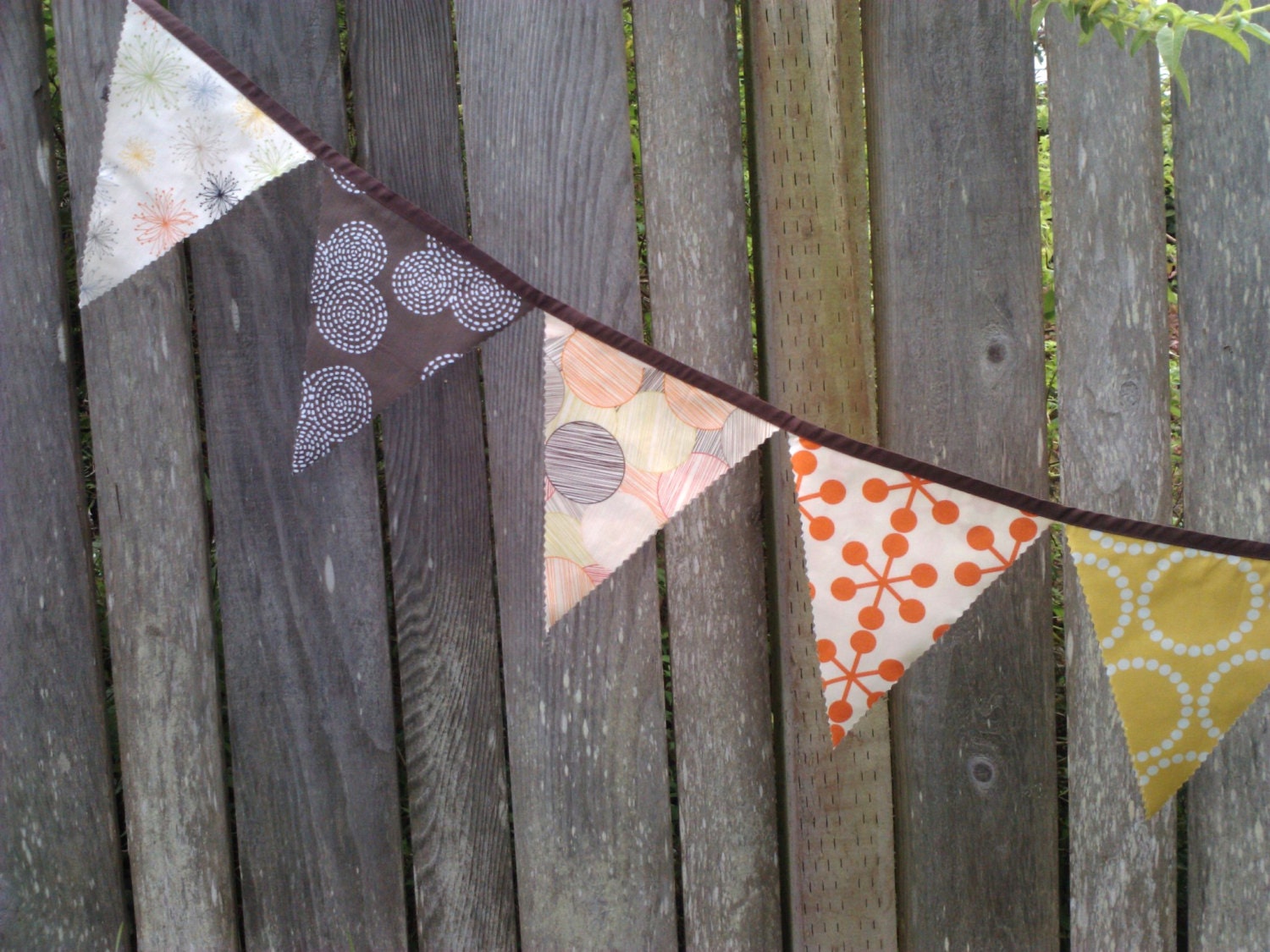 Bunting Flags Home Decoration Organic Geometric shapes with natural colors in brown, persimmon, lemon, and shades of coral, grey, lime.