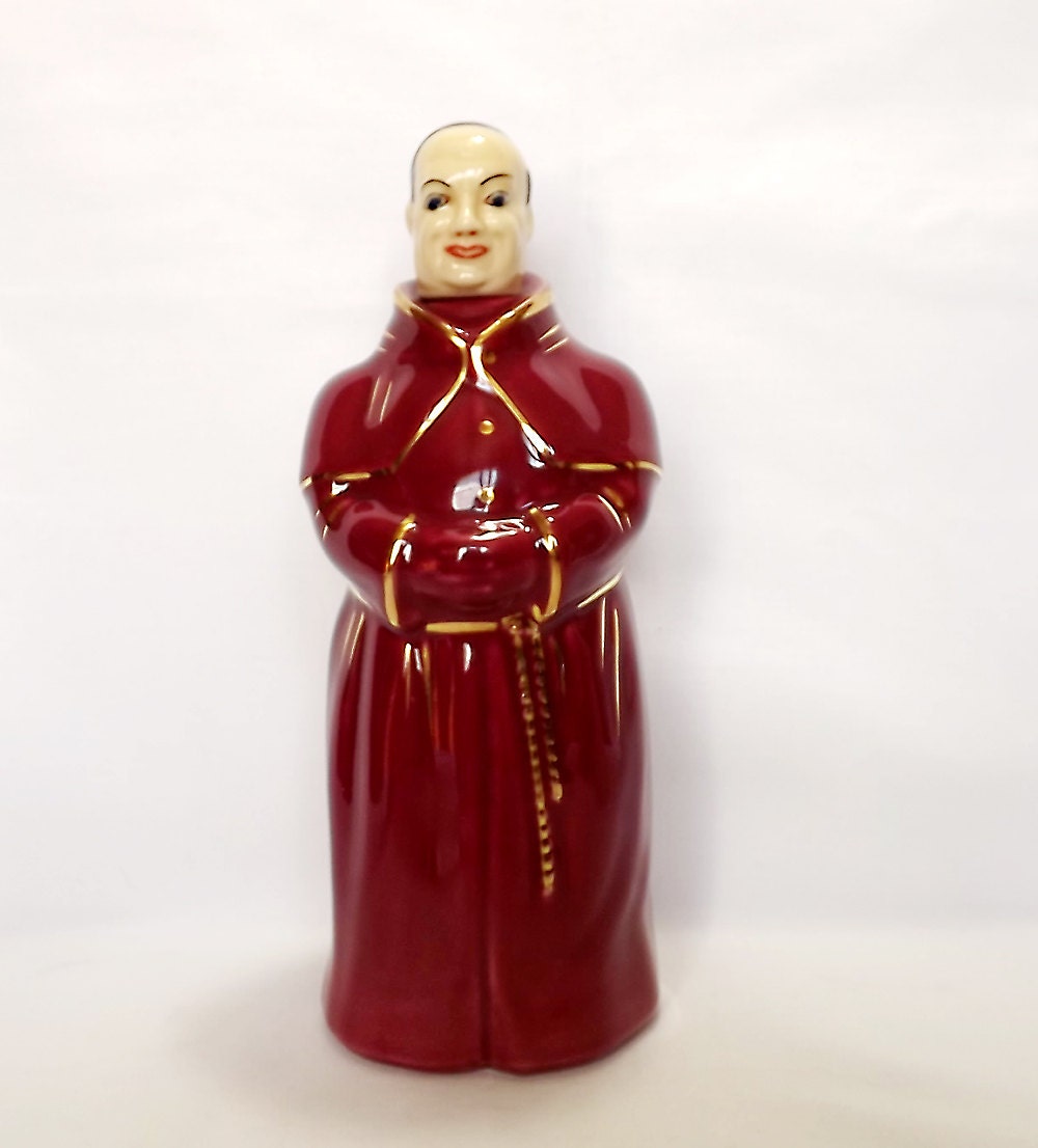 Ceramic cardinal decanter in raspberry red cassock