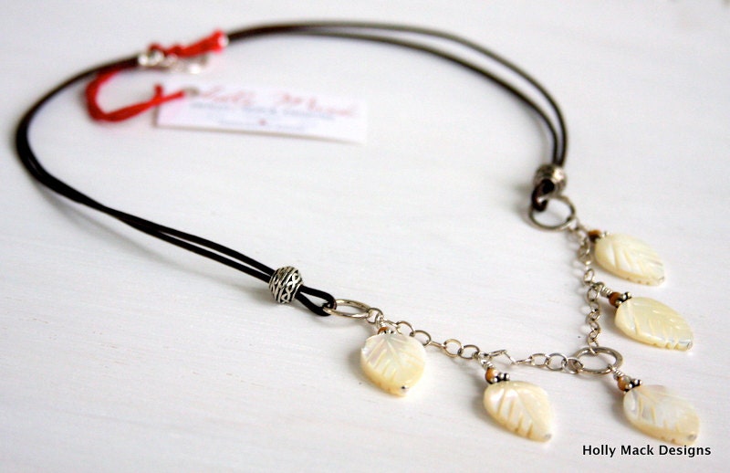 Brown leather necklace with sterling silver chain, wire wrapped mother of pearl leaf beads, sterling silver beads and toggle