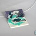 Necklace with handmade pendant in purple, white and a touch of blue