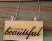 Large yellow and white resin pendant necklace with words 'everything beautiful'. Large rectangle 5cm x 2.5cm