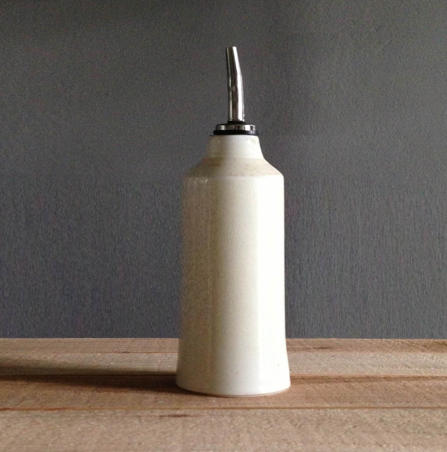 SAMPLE ceramic bottle with pourer . white porcelain bottle with premade pouring spout .
