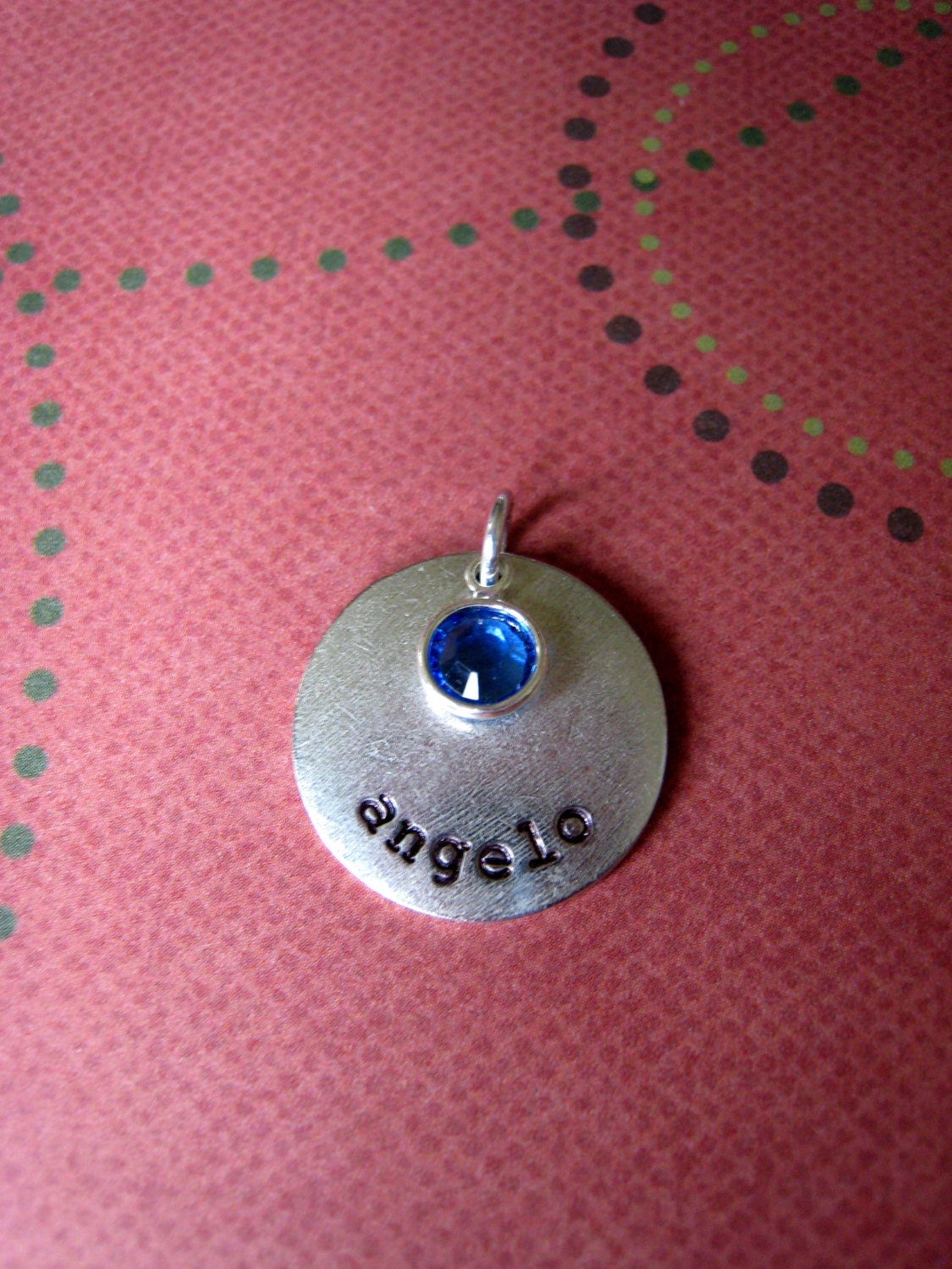 A la carte rectangle or circle tag with name and stone or pearl.  No chain, just an extra pendant.