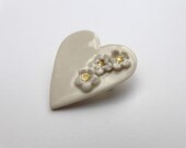 Cream heart brooch, porcelain, with small cream and gold flowers
