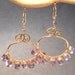 Luxe Bijoux 183 Pale amethyst wrapped onto swirl hoops