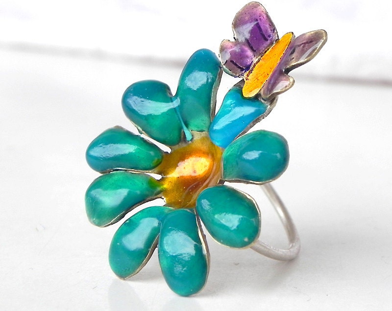 Handmade 3D brass flower with enamel, butterfly, sterling silver wire ring base.