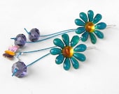 Handmade earrings, painted white 3D metallic daisies and butterfly. Sterling silver hangers.