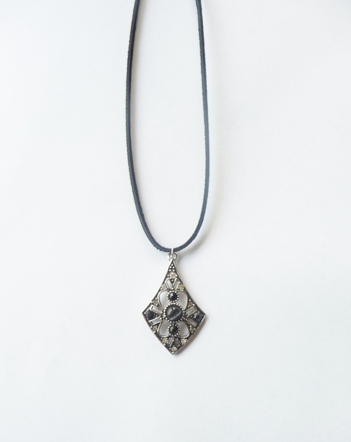 Black Cat Eye Pendant -- on a suede cord