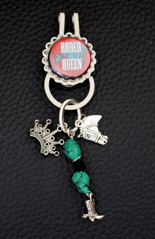 Red and Blue colored "Rodeo Queen" BootiClip with silver bezel.  Trinket consists of a cowboy boot, a crown, a horse head and beads. WEQ005