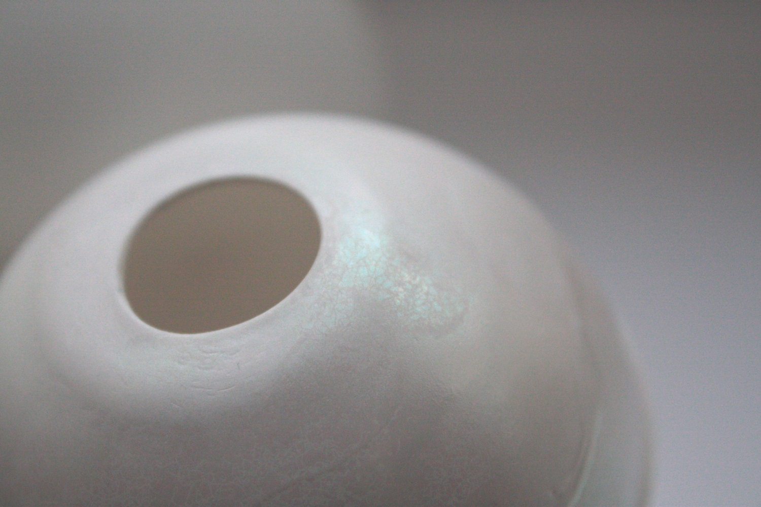 White spheres made from English fine bone china with a hint of mother of pearl on the top half - geometric decor