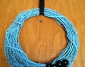 Modern style Spring Wreath with rolled fabric rosettes and gemstones.  18" diameter.