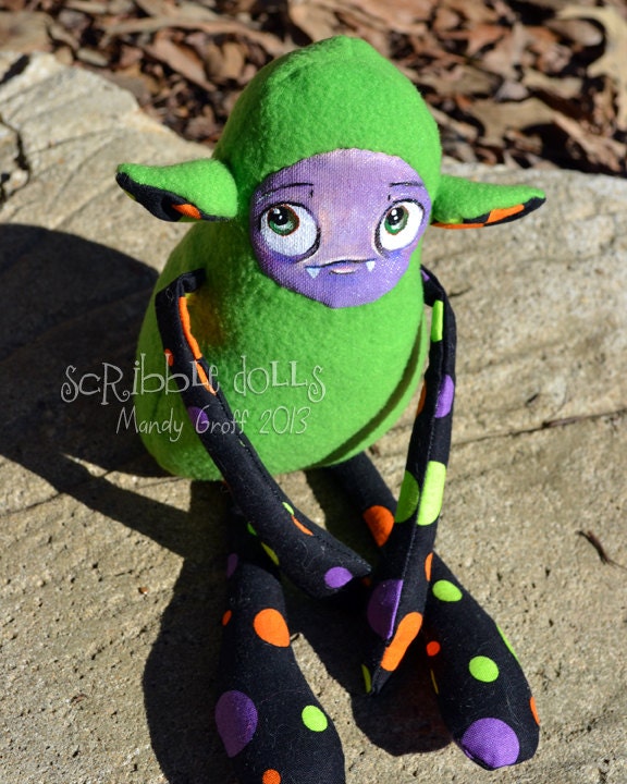 Glurp, a green, purple, orange, and black plush monster art doll