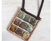 Square boho pendant with natural blue and brown gemstone.