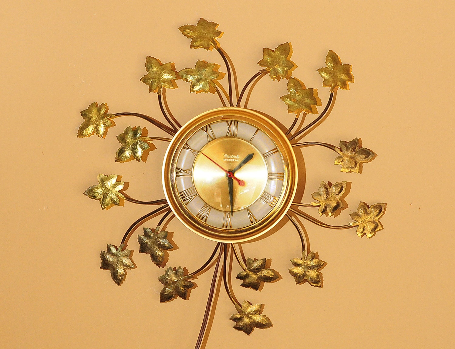 starburst clock, sunburst clock, wall clock, mid century, retro, ivy leaf , United, Brooklyn NY, brass look, electric, hollywood regency,