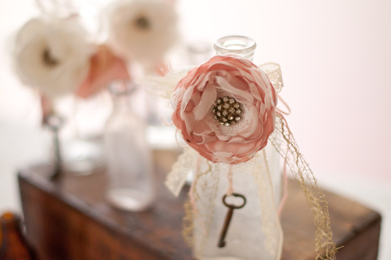 Antique glass bottle with shabby chic flower, skeleton key, wedding table decoration, ivory and blush