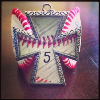 Cross baseball pendant with bling and number (bracelet in background sold separately). Number size and style may vary.