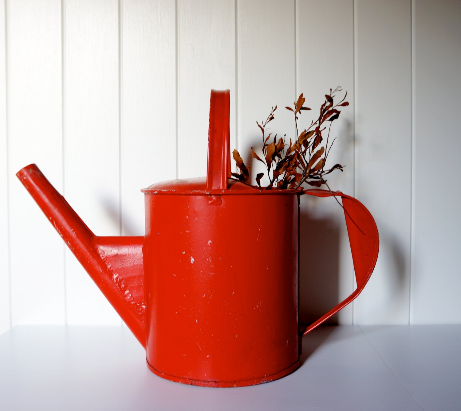 Vintage red watering can
