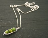 Three peas in a pod, green mother of pearl peapod pendant necklace on sterling silver chain.
