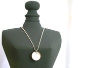 Enameled lucky penny pendant necklace on basemetal chain, Titanium.