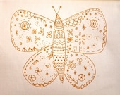 medium butterfly embroidery stitching pattern on fabric