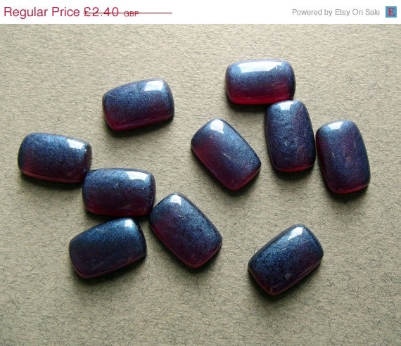 Ten vintage iridescent purple cabochons