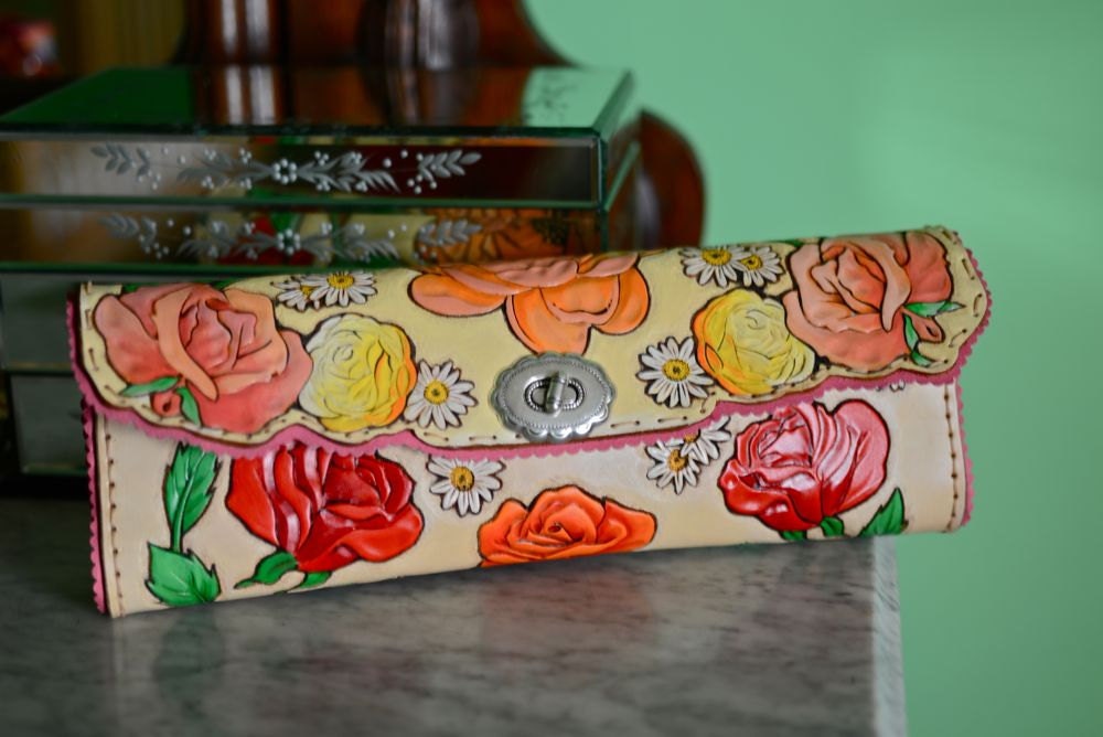 The Best Nest Heirloom Hand Tooled Leather Clutch. Blossoms Everywhere. Scalloped suede edges. Hand Stitched. Sweet Double Inlay Nest.