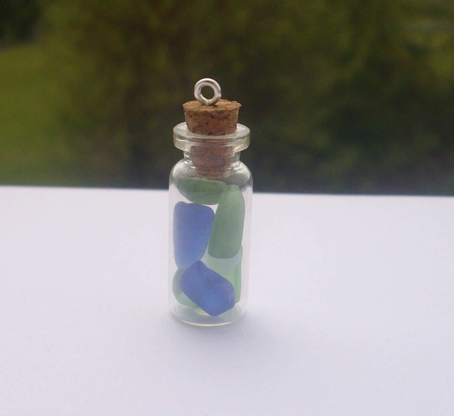 Sea glass filled vial bottle