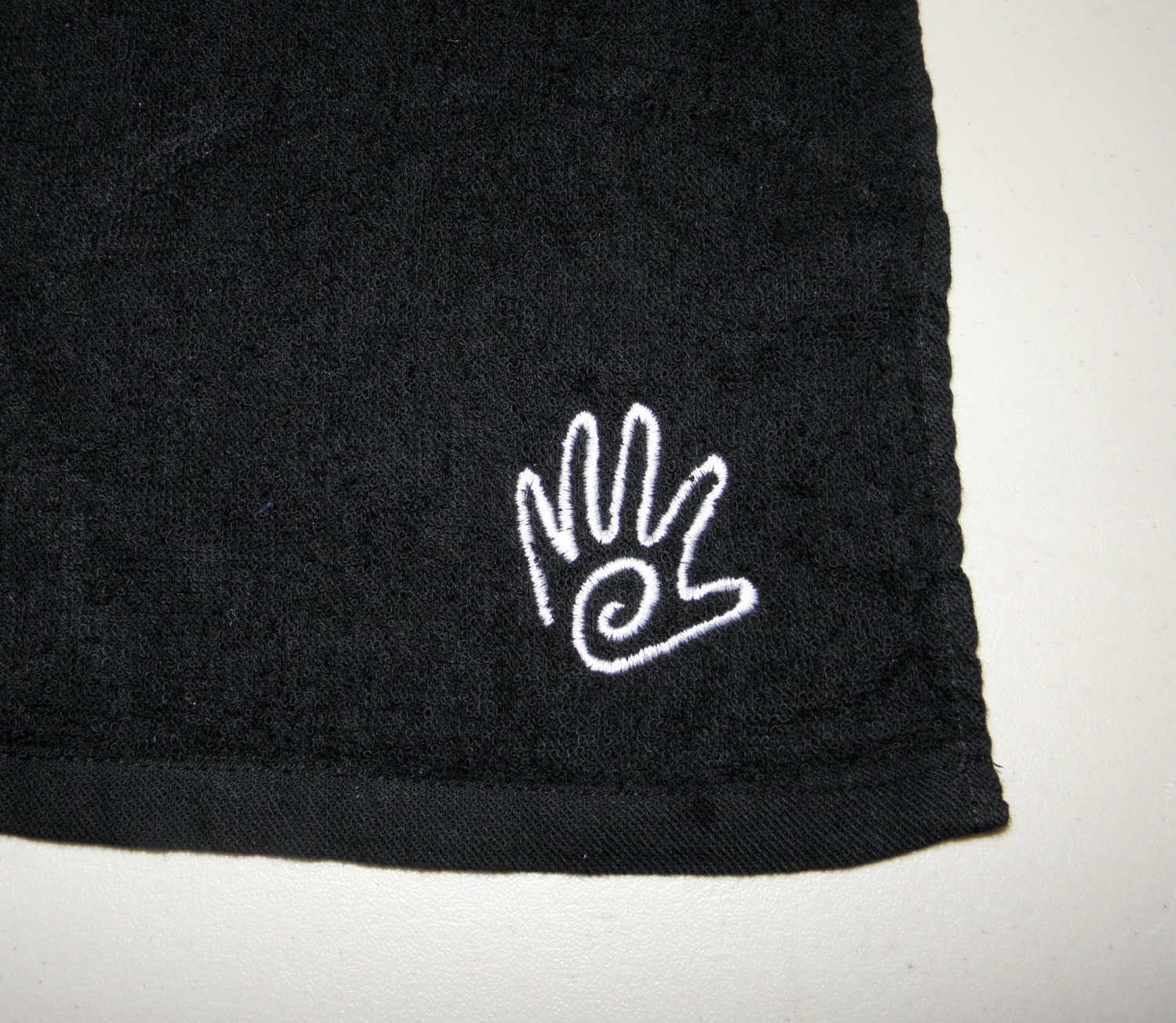 Black Fingertip Rally Towel Embroidered with Swirl Hand Black