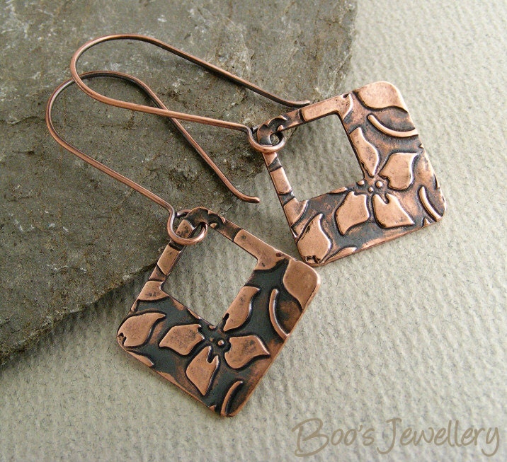 Antiqued copper earrings with large square charms with flower imprint on long drop earwires