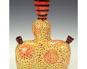 Eccentric Bud Vase Wearing Dotted Bustle.
