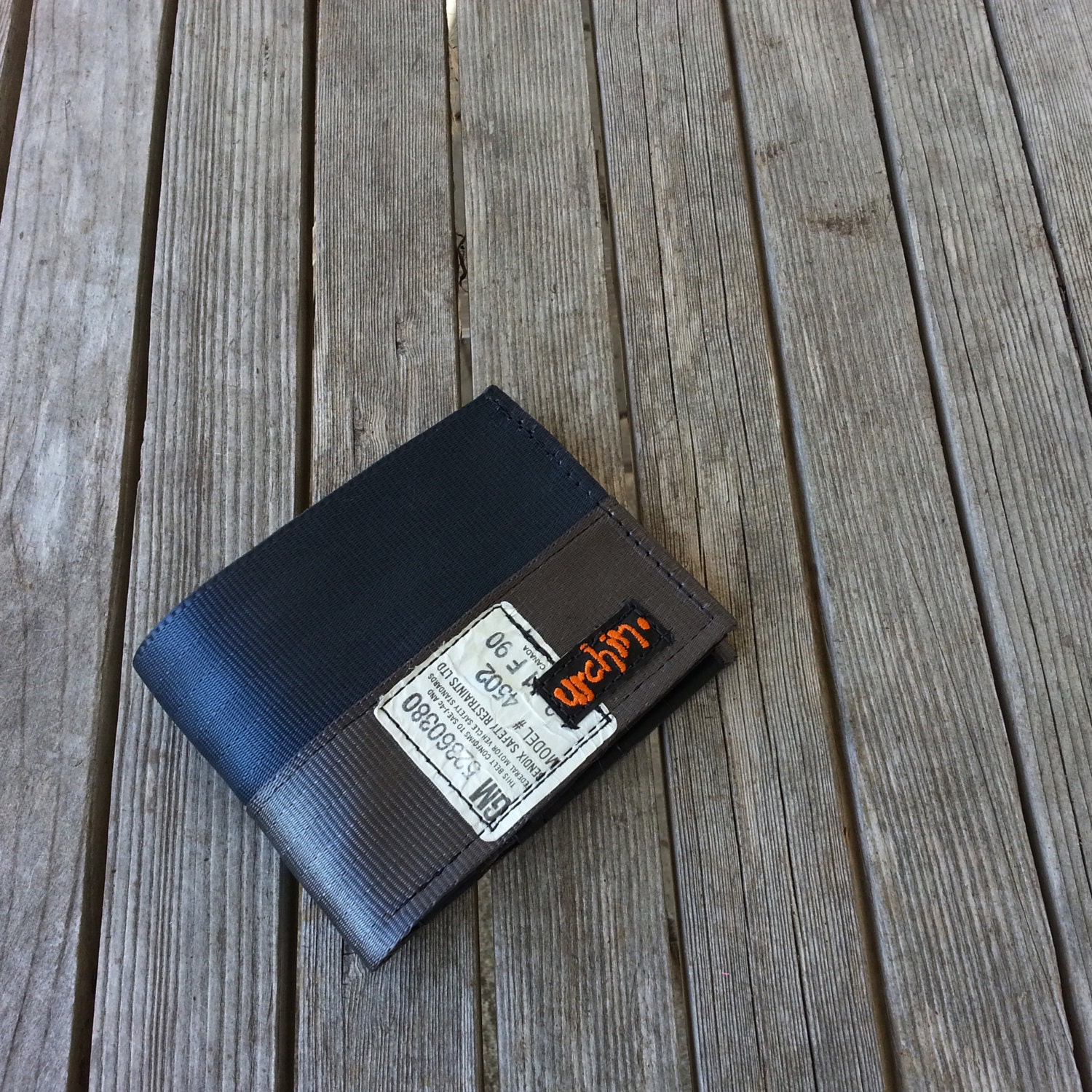 Seat belt wallet made from reclaimed seat belt straps and used bike inner tube