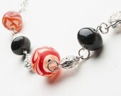 Chunky  orange red  necklace with black glass bead and silver spacer