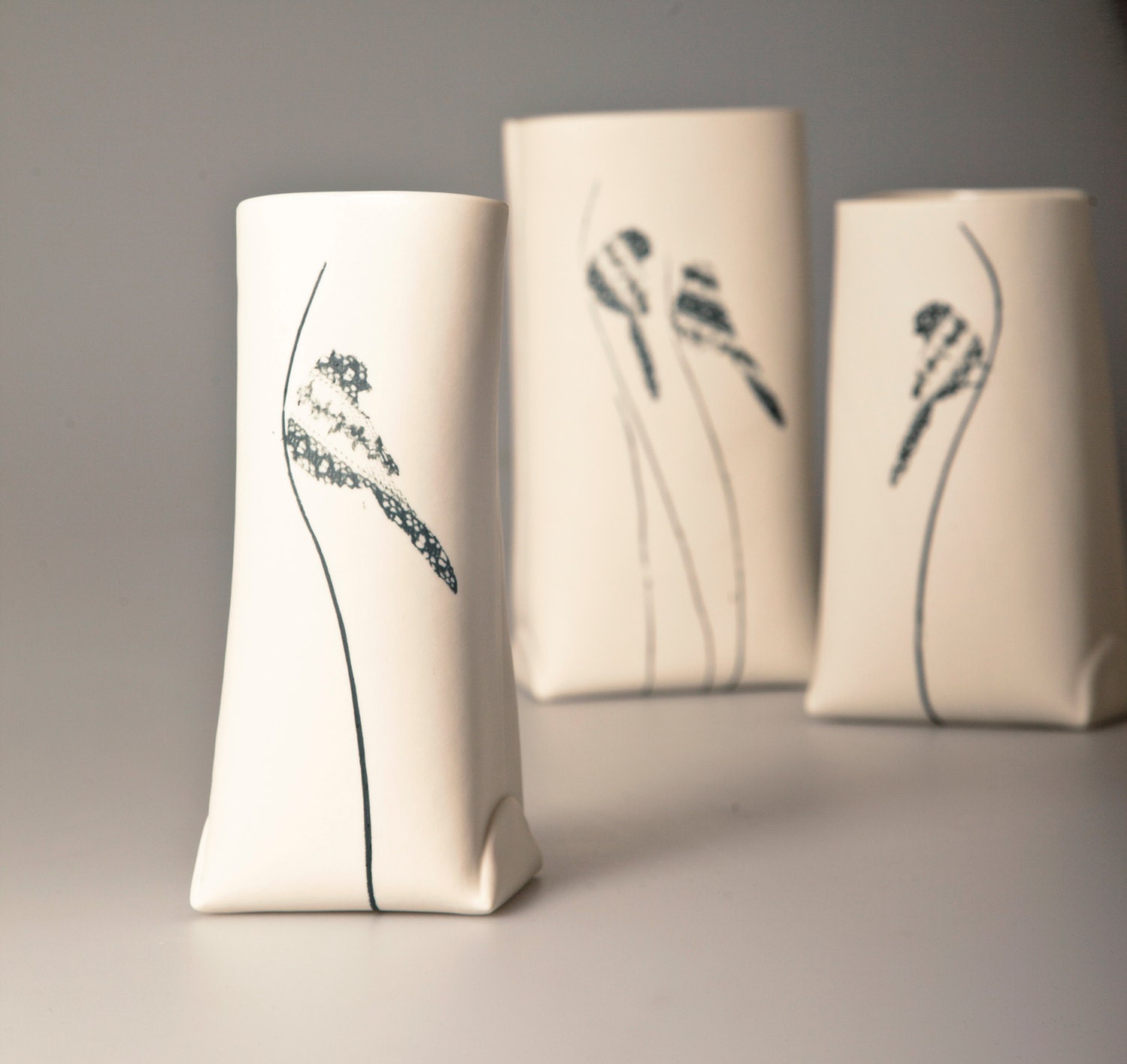P-Sack.  Porcelain Vase with A Black Bird (small). Contemporary ceramic craft. Designed and Crafted by Wapa Studio