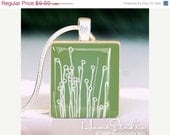 Moving Sale - Wildflowers (Green) : a pendant charm made with a wood Scrabble tile game piece