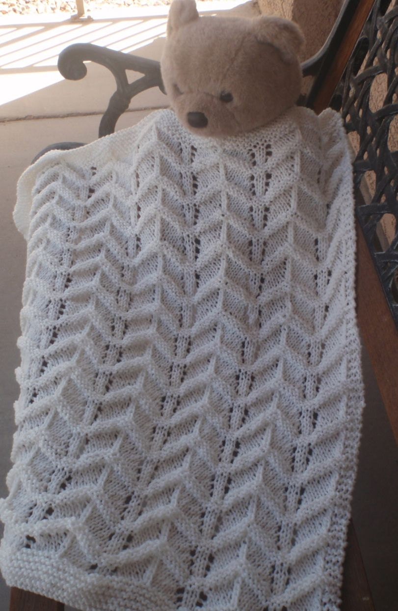 Hand knitted, winter white baby blanket in unique design for a boy or a girl