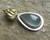 Fire and water sterling and brass pendant with large blue aquamarine cabochon