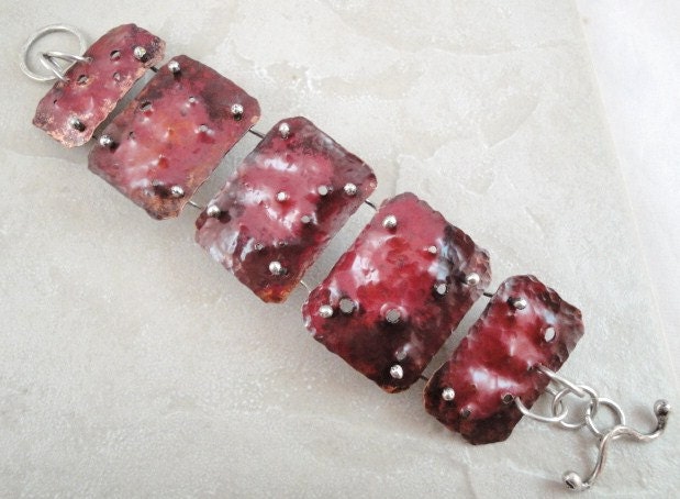 Copper hinged bracelet. Sterling silver. Red. Industrial. Holes. Texture. Bumpy. Toggle clasp