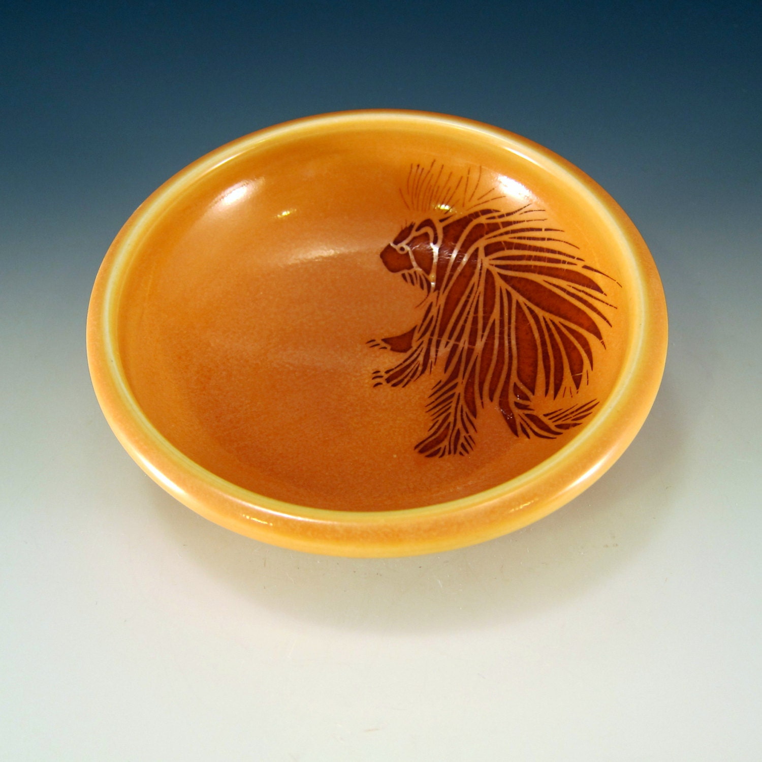 Kid sized bowl - amber glaze, with porcupine
