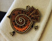 A sweet little woolly robin brooch