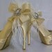 Sparkling Champagne ... champagne satin stilettos with Swarovski crystal and beaded adorned toes and Feathery flourish
