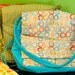 Shower that new mom with a soft colorful diaper bag.
