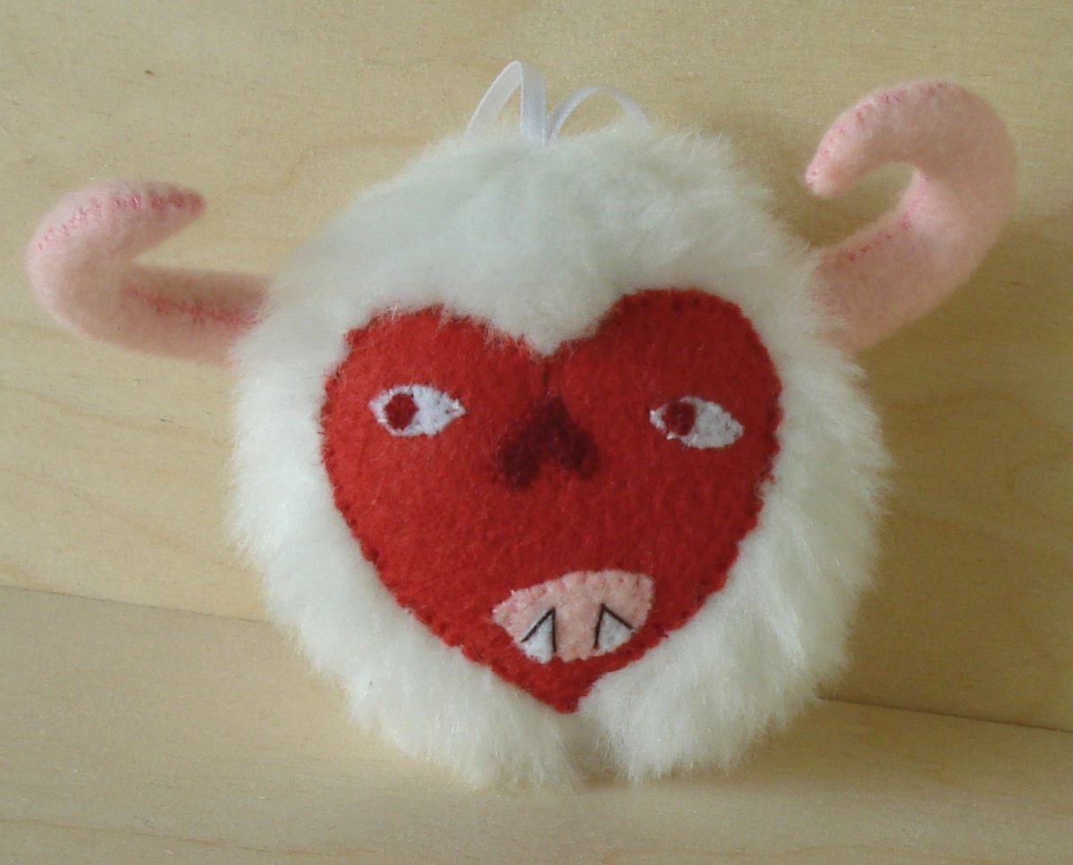 Monster face ornament, red and white