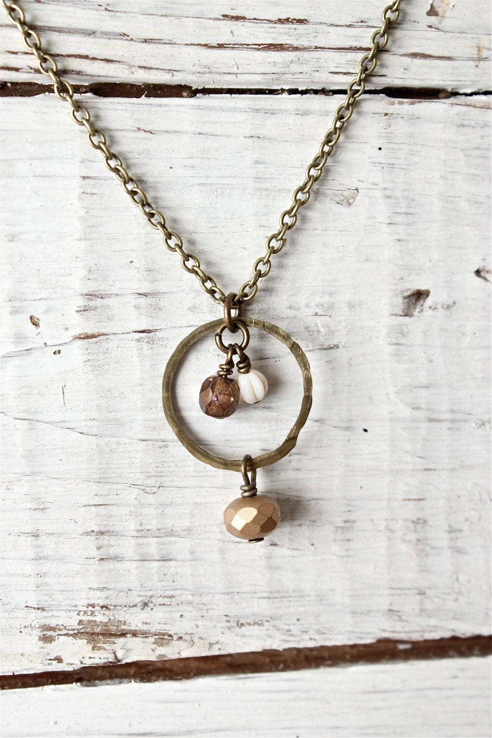 Hammered antique brass beaded necklace.  Czech glass beads.  Gold ivory bronze.  Dainty and simple.