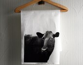 White teatowel screenprinted with mrs Cow