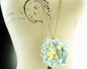Irene Necklace. Flower pendant on long chain necklace handmade by Cardinal House.