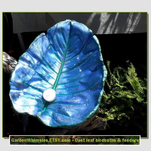 A Parrish blue Philodendron leaf cast into a birdbath/feeder on a pole (Leaf no. 1412)