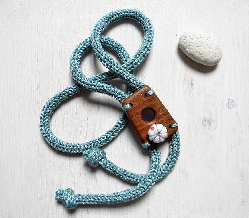 Necklace with wood pendant and flower. Brown wood and aqua green. Wooden necklace